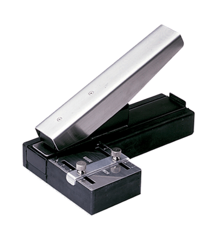Stapled-style slot punch with Adjustable Centering Guide